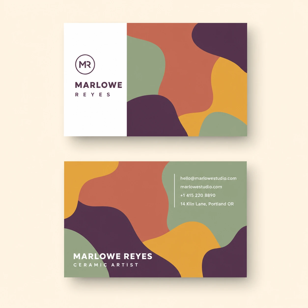 A two-sided business card mockup featuring organic abstract blobs in earthy tones with a circular monogram and clean sans-serif branding.