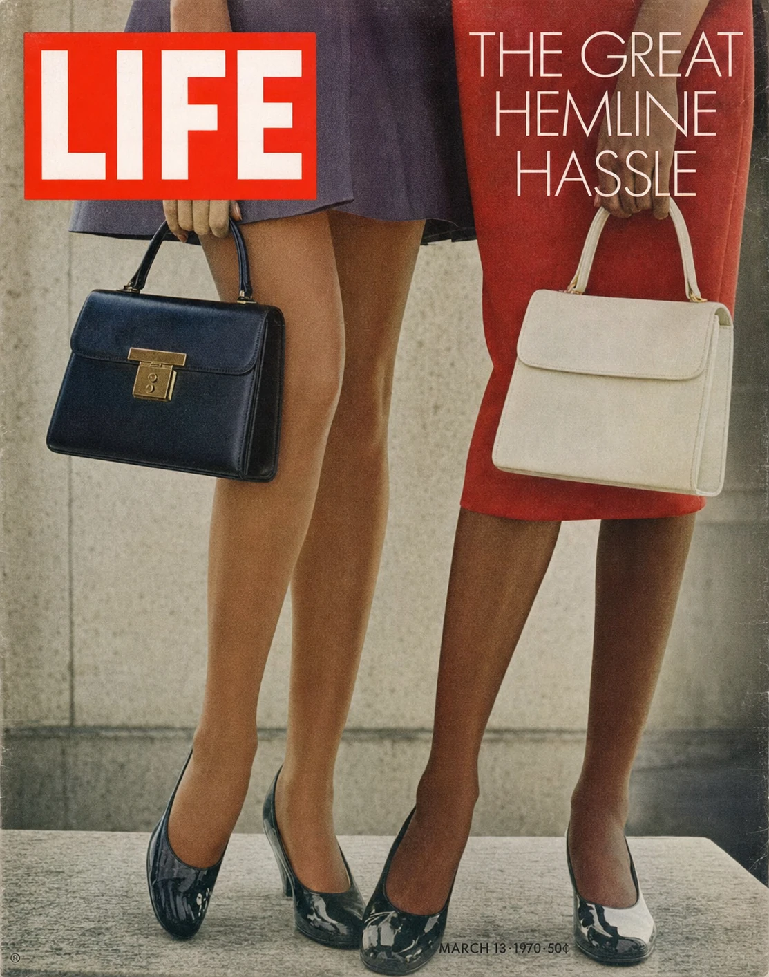 A vintage magazine cover showing two women's legs from the waist down, holding handbags, with bold cover-title typography.