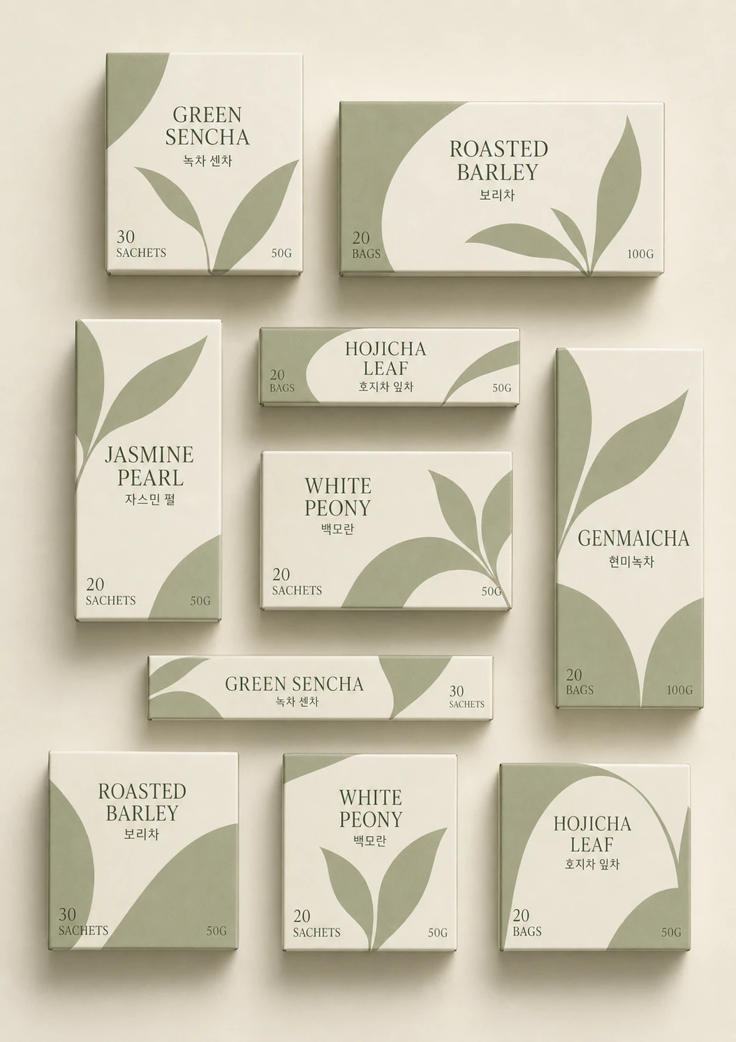 A flat-lay arrangement of minimalist tea packaging boxes featuring sage-green leaf illustrations on cream backgrounds.
