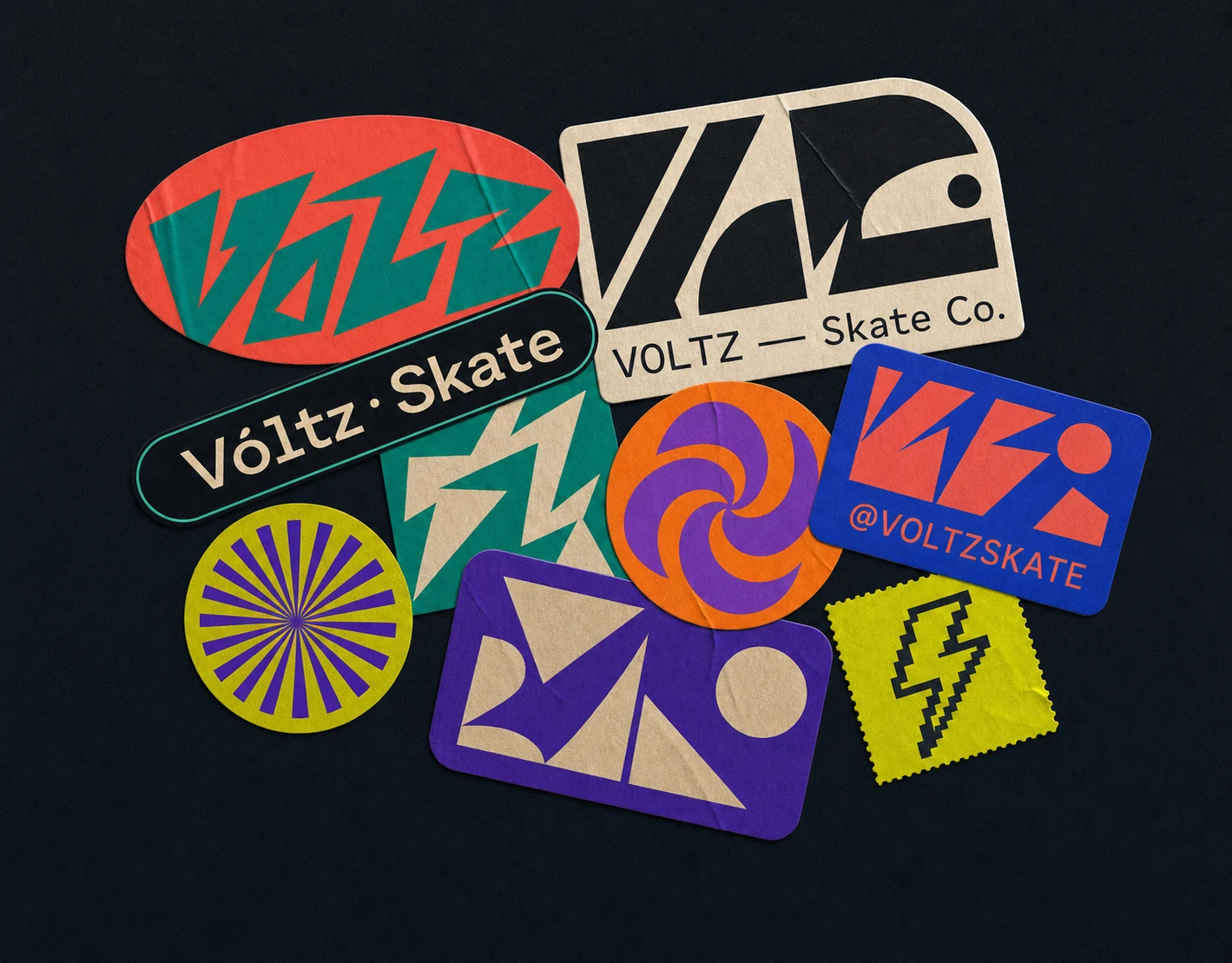 An overlapping collage of branded skate-culture stickers in varied shapes and bold geometric graphics scattered on a dark surface.