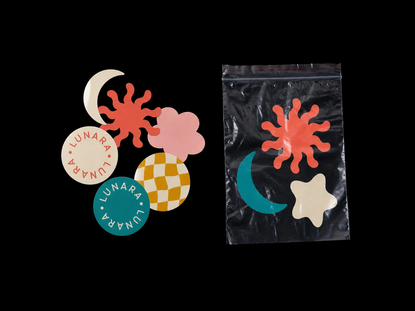 A flat-lay product photo of a playful sticker set—loose die-cut shapes beside a clear resealable pouch—shot on a stark black background.