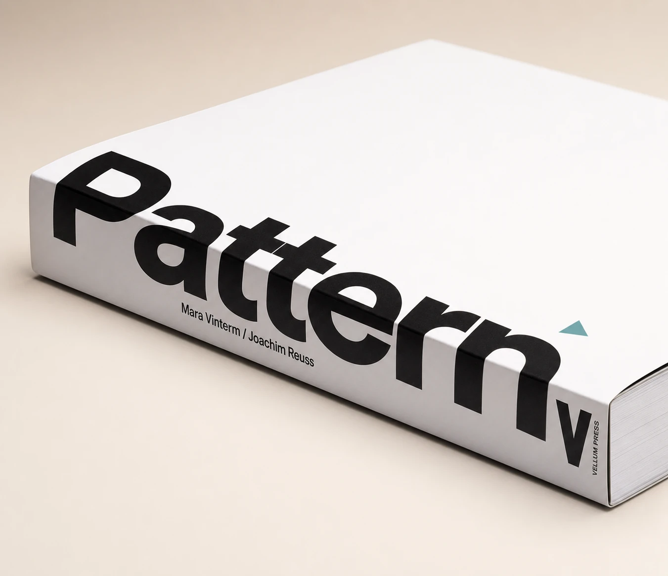 A photorealistic mockup of a thick white hardcover book lying flat, with an oversized black title wrapping across the cover and spine.