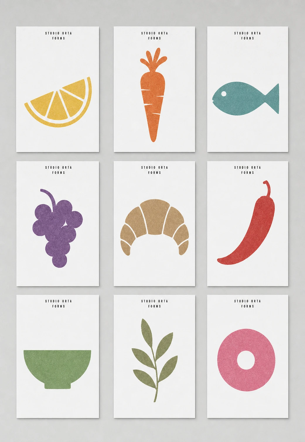 A grid of nine minimalist cards, each showing a single colorful food or kitchen icon with a small centered header label.