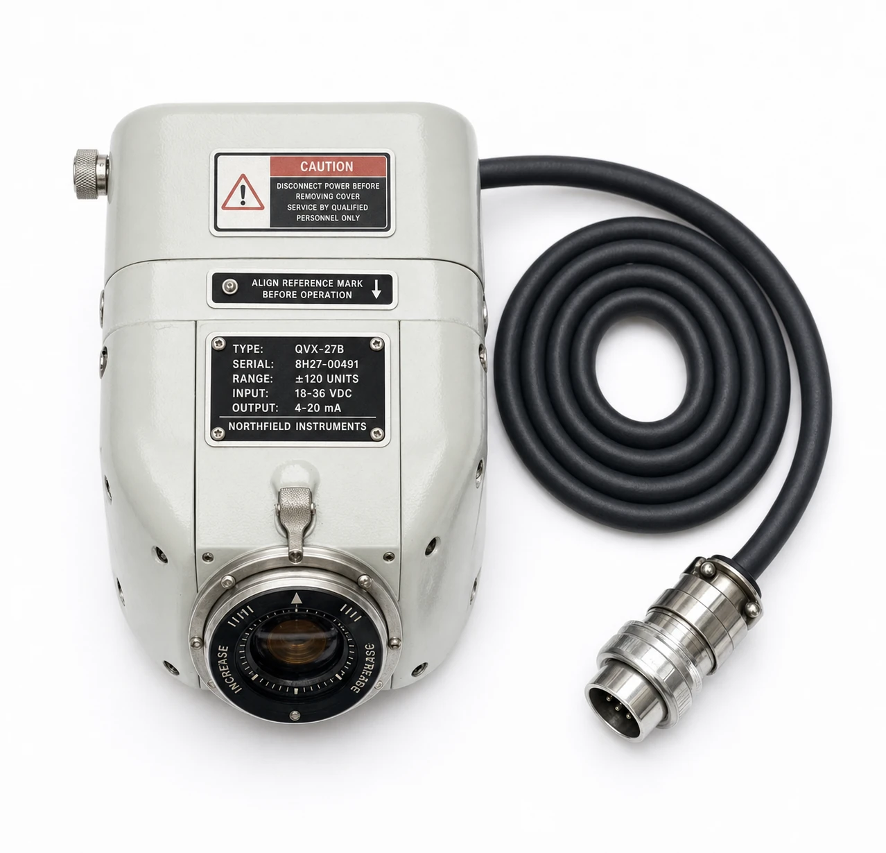 A studio product photograph of a vintage-industrial precision instrument with a coiled cable and connector on a clean white background.