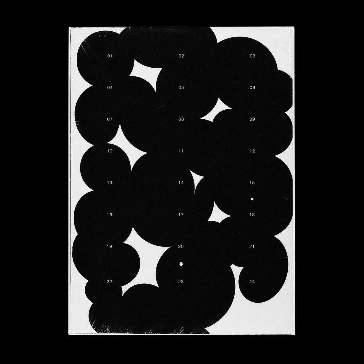 A high-contrast black-and-white poster featuring overlapping organic blob shapes overlaid with a tidy numbered grid, shrink-wrapped and photographed on a black