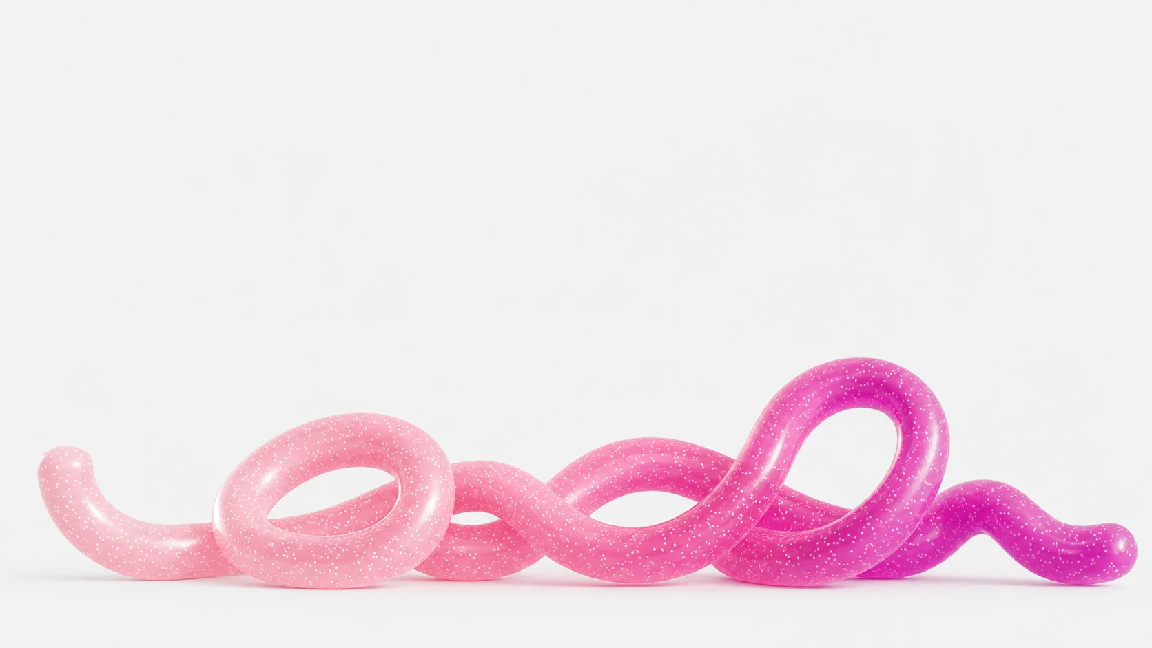 A glossy, looping pink-to-magenta gradient tube coils horizontally across a clean white floor, rendered as a translucent glitter-flecked 3D form.
