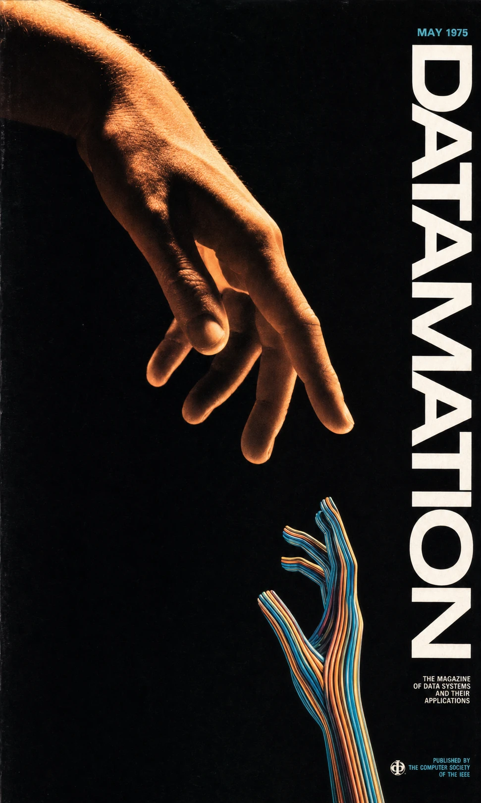 A dramatic magazine cover where a warmly-lit human hand reaches down toward an upward-reaching hand sculpted entirely from colored wires, evoking a human-machin