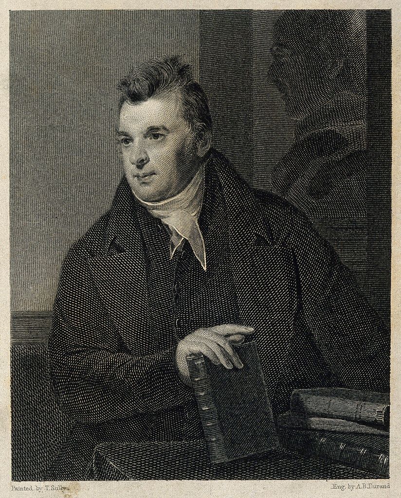 A black and white engraving of a man in a formal coat, holding a stack of books.