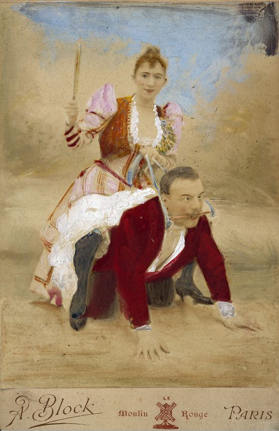 A vintage hand-colored photograph of a woman seated on the shoulders of a man, with text at the bottom reading “A. Block,” “Moulin Rouge,” and “Paris.”
