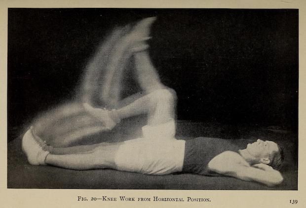 Vintage black and white photograph of a person doing a knee exercise while lying on their back.