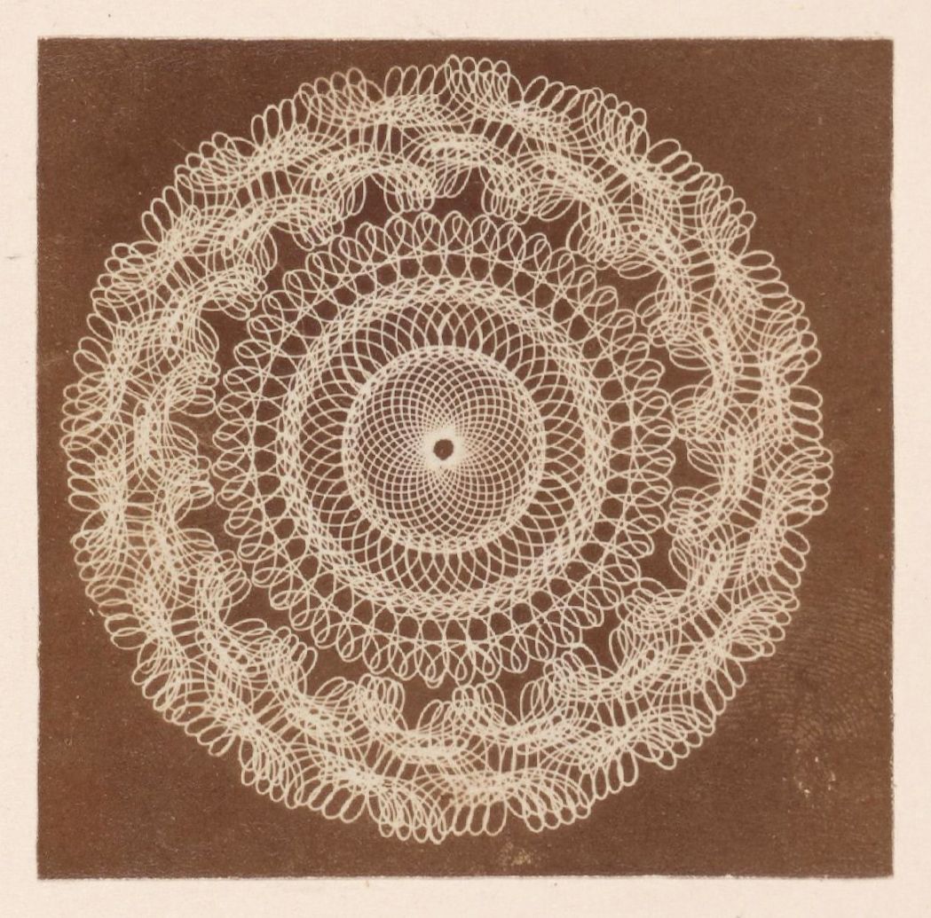 Sepia-toned photograph of a circular pattern created by spiraling lines.