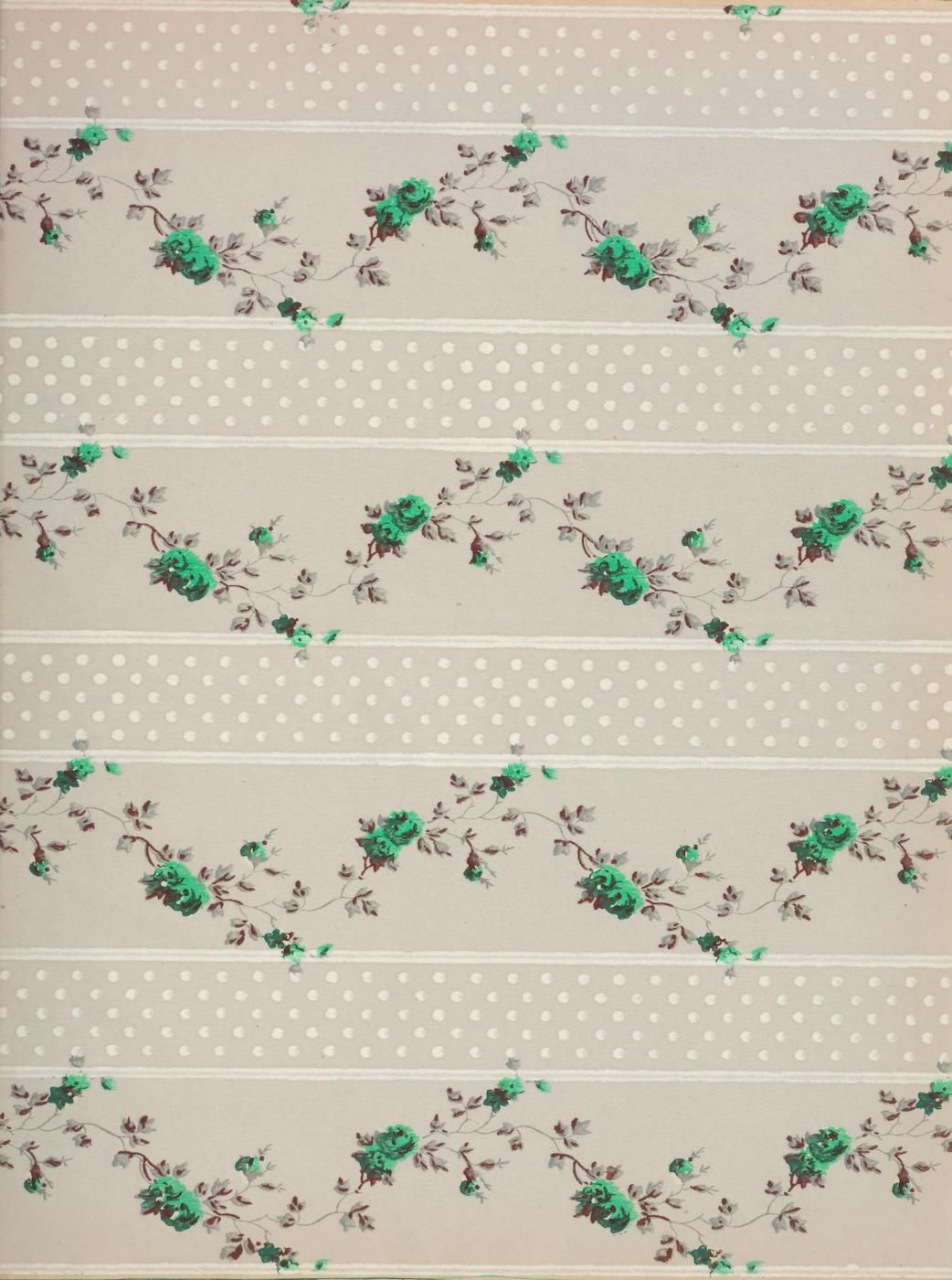 Close-up of a fabric with a repeating floral pattern of teal roses and brown leaves on a creamy, off-white background with small, light gray dots.