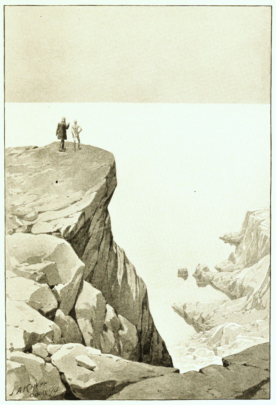 Two men stand on the edge of a rocky cliff, looking out at a hazy landscape.