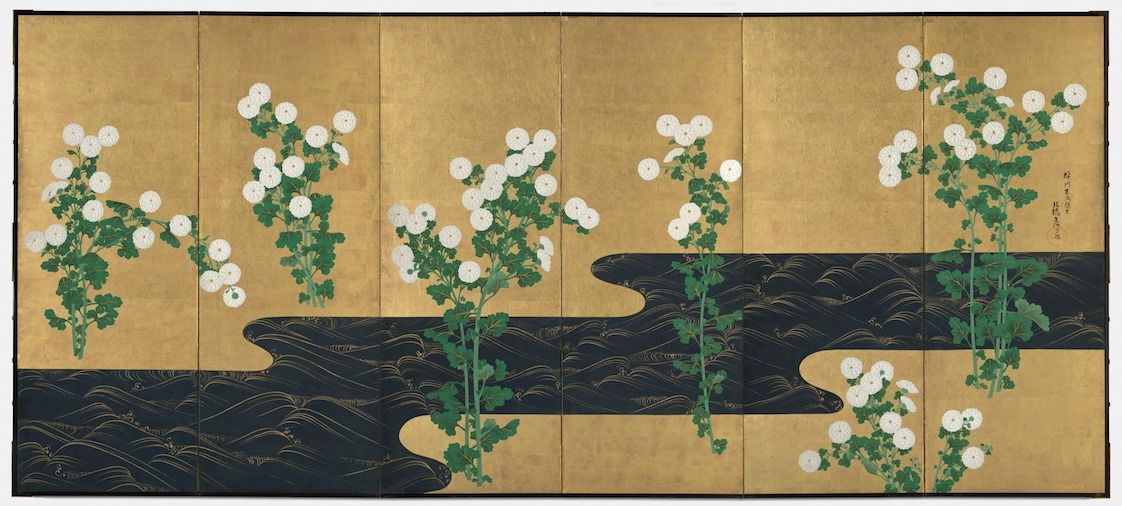 A traditional Japanese folding screen painting with white flowers and a black river on a gold background.