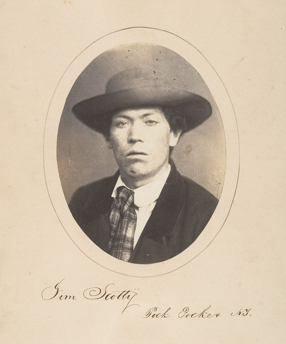 Vintage sepia-toned photograph of a man named Jim Scotty, Duck Seeker, N.Y., wearing a hat and coat.