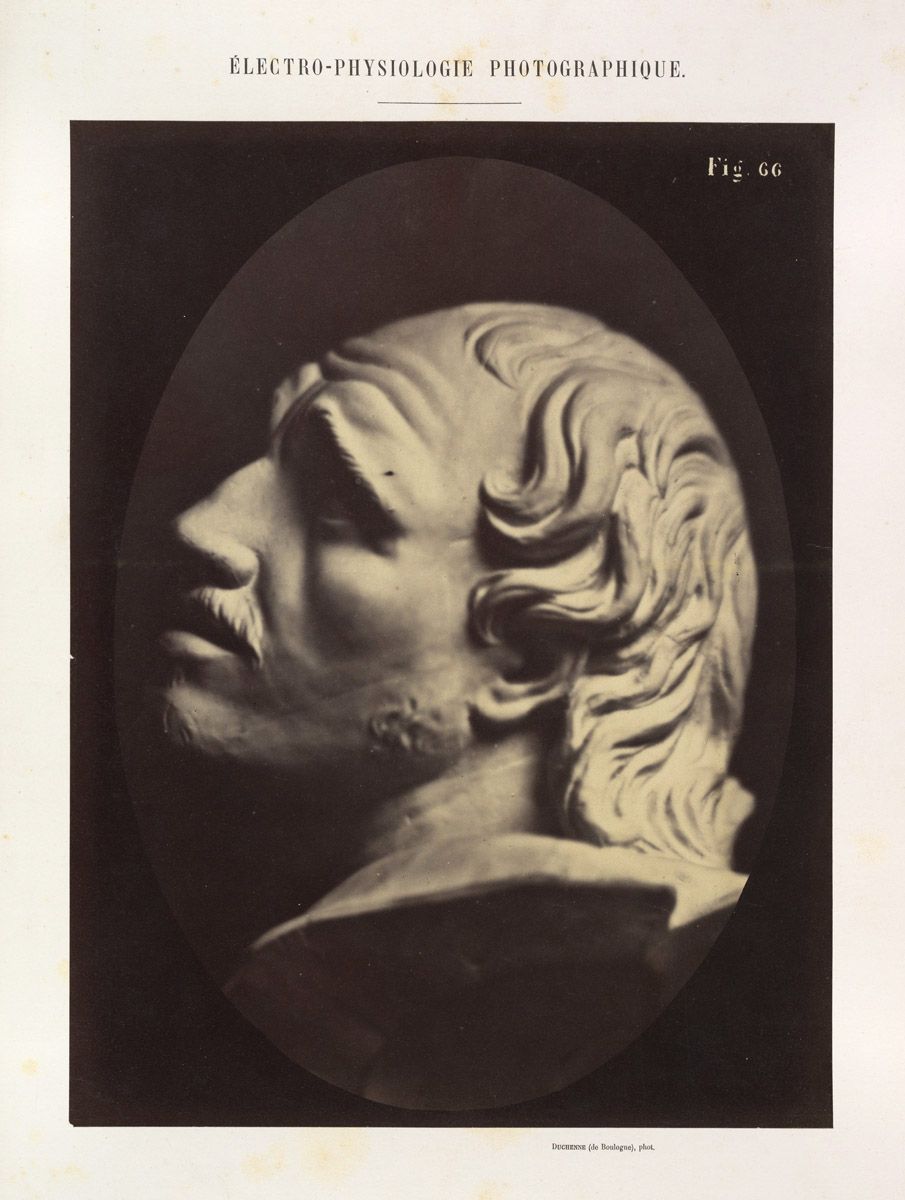 Vintage photograph titled "Electro-Physiologie Photographique" depicting a man's head and shoulder in high contrast.