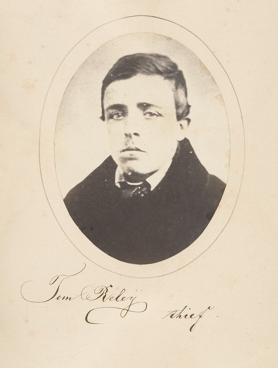 Vintage black and white portrait of Tom Riley, labeled as a thief.