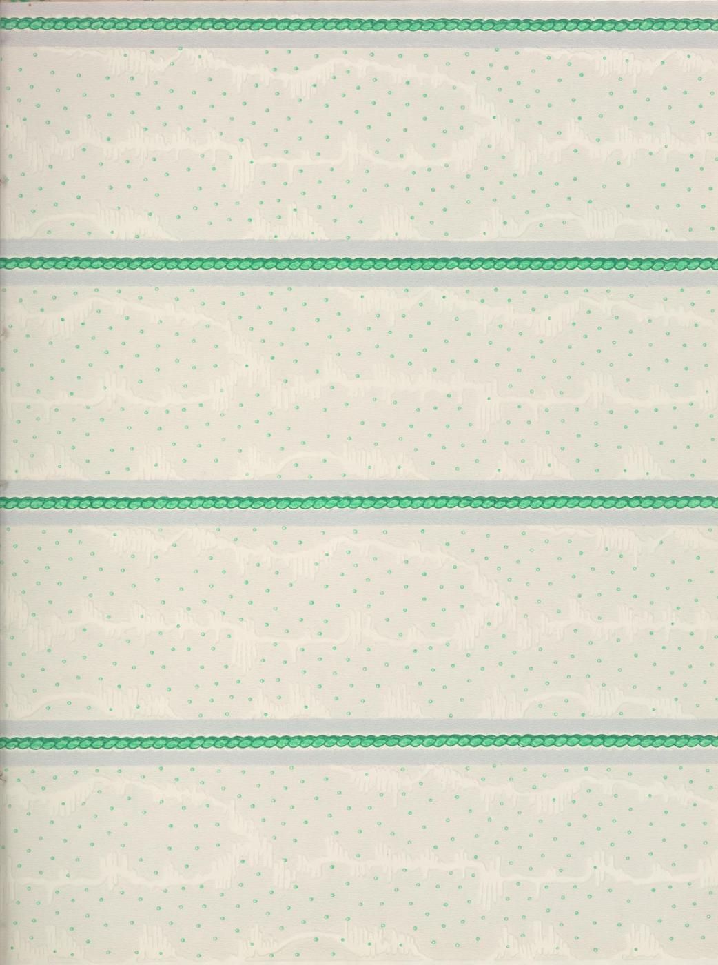 Close-up of a beige fabric with scattered green dots and horizontal dark green lines with repeating circles.