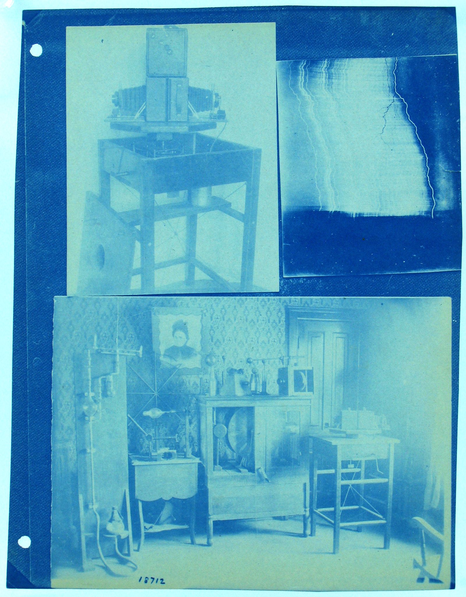 A vintage cyanotype collage featuring a wooden structure, a lightning strike, and a room interior with a fireplace and vintage furniture.