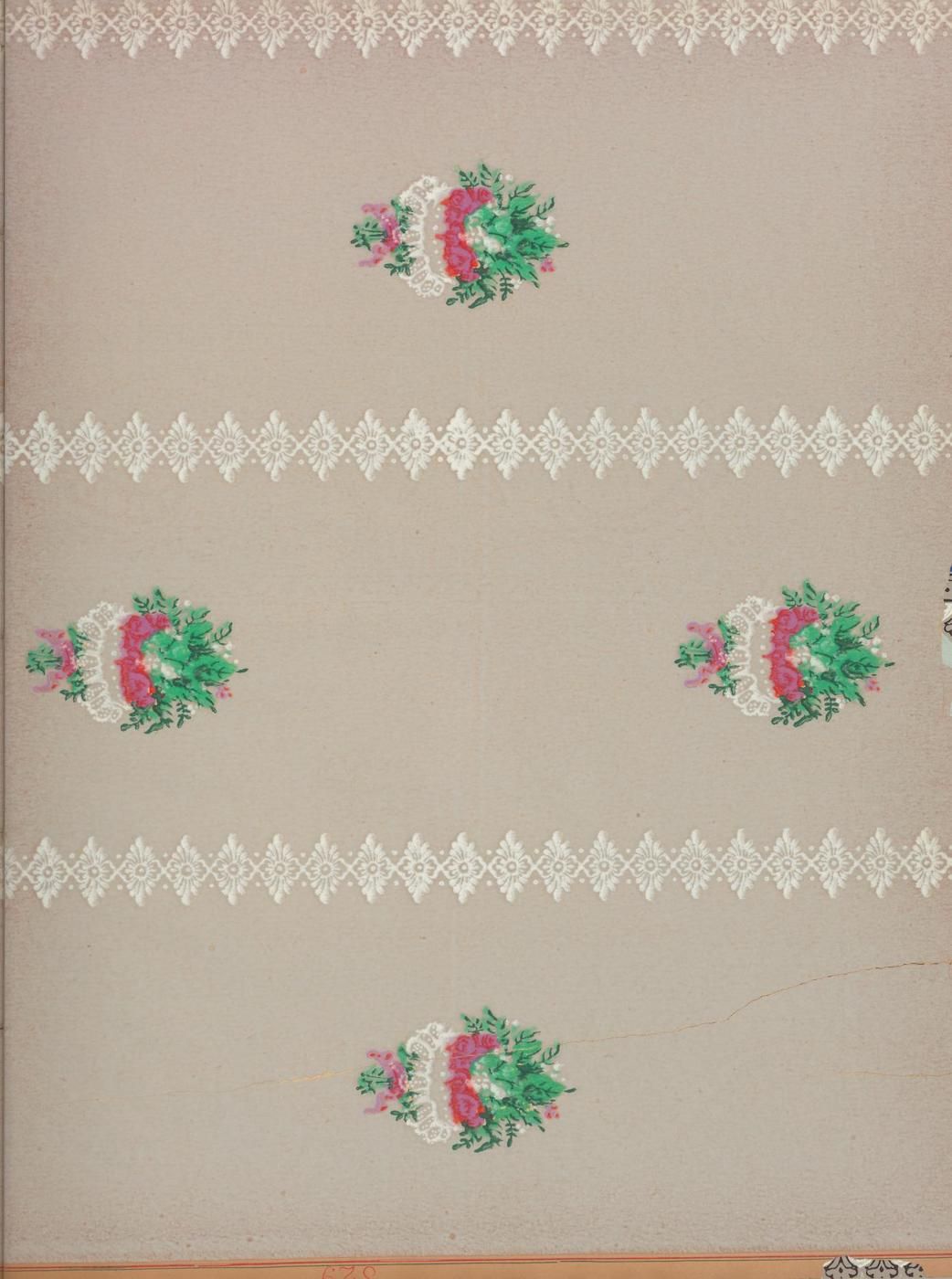 Close-up of vintage wallpaper with a repeating floral pattern and delicate border.