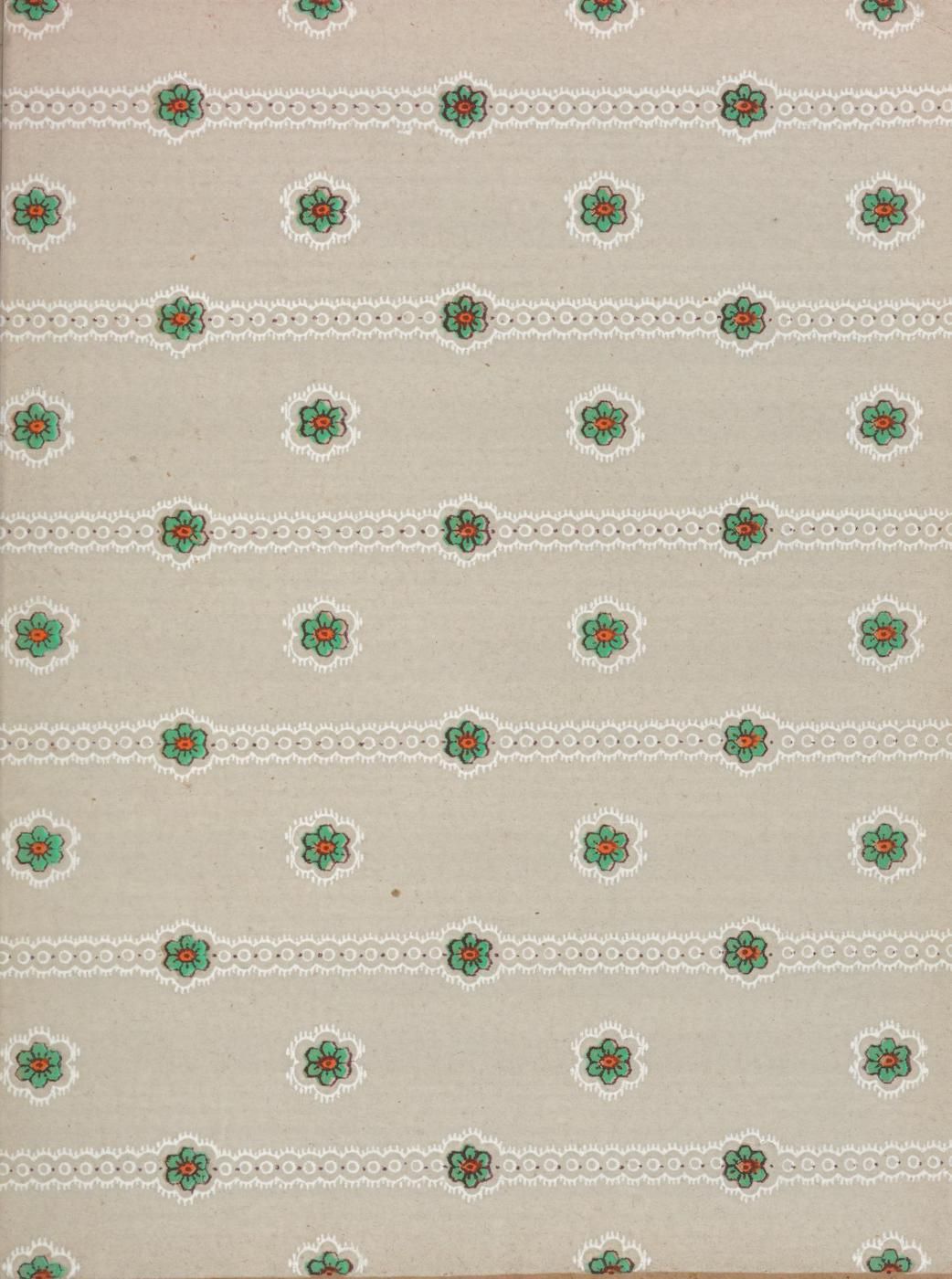 Vintage floral pattern with red, blue, and green flowers on a beige background, framed by a delicate white lace border.