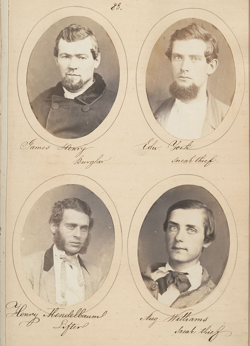 A vintage photograph of a page from a police rogues' gallery, featuring four oval portraits of men identified as criminals.