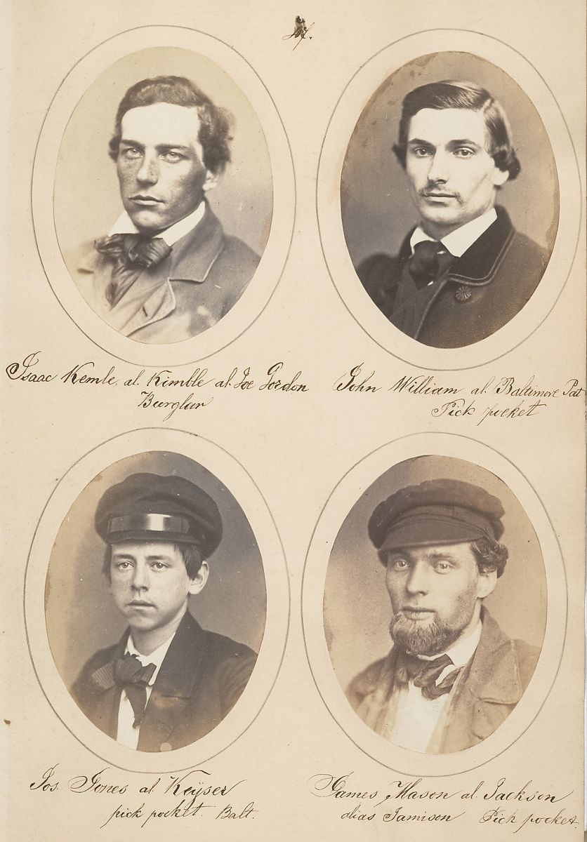 Four oval portraits of young men in sepia tone, each with handwritten identification beneath.