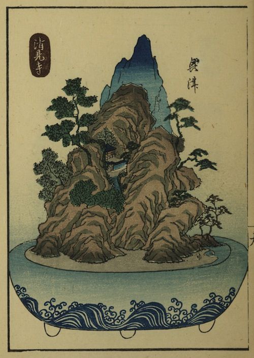 Vintage Japanese woodblock print of a mountainous island with trees and waves.