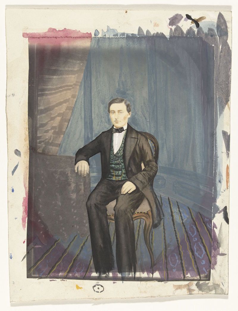Vintage-style portrait of a man in a black suit seated in a chair against a dark blue background, with a distressed and collage-like effect.