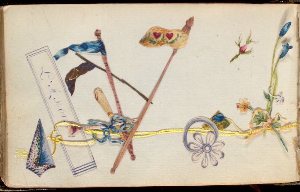 A vintage card with a whimsical arrangement of objects glued onto its surface.