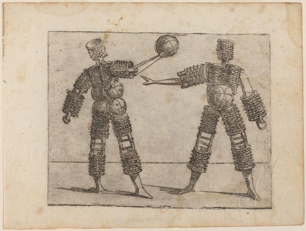 Two mechanical figures playing a game with a ball.