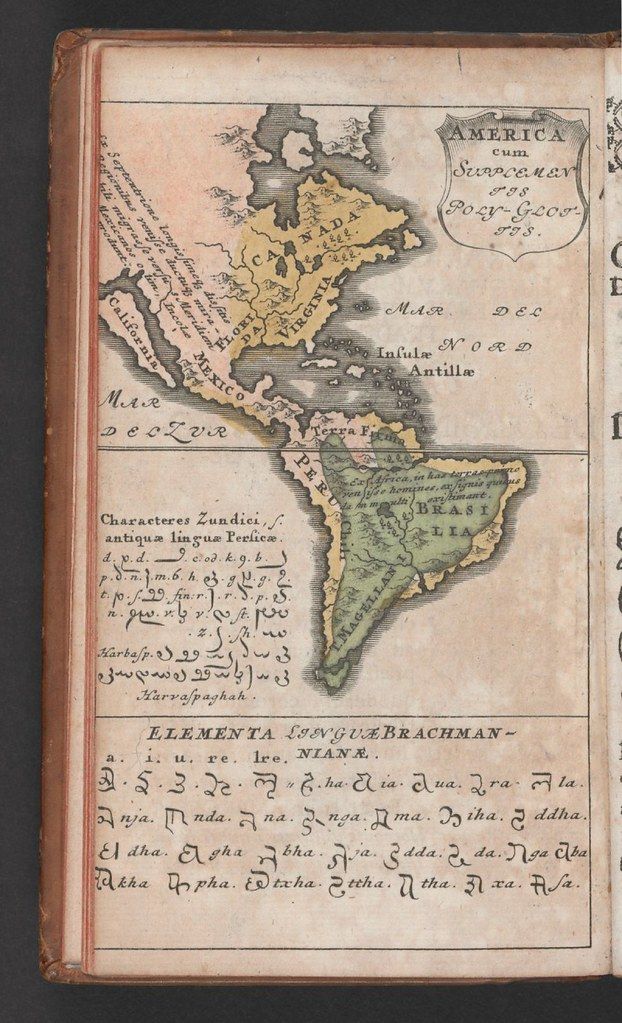 A vintage map of the Americas with text in ancient scripts.