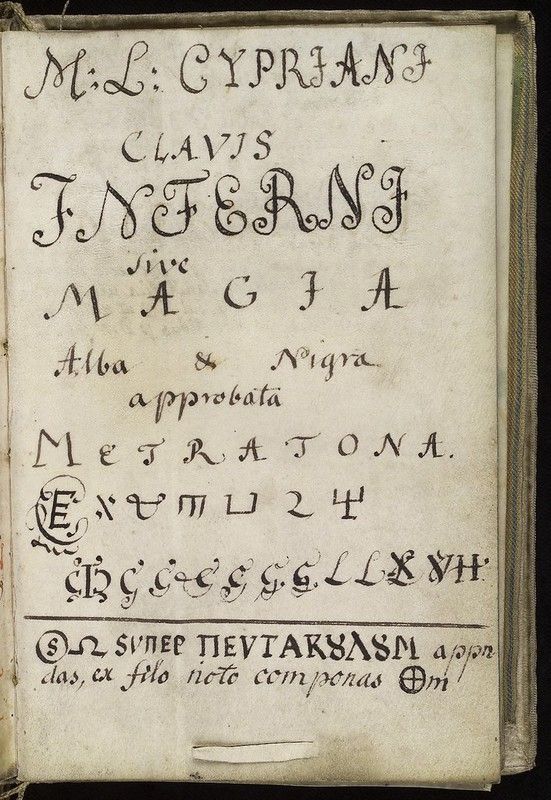 A page from an old book with ornate Latin text and occult symbols.