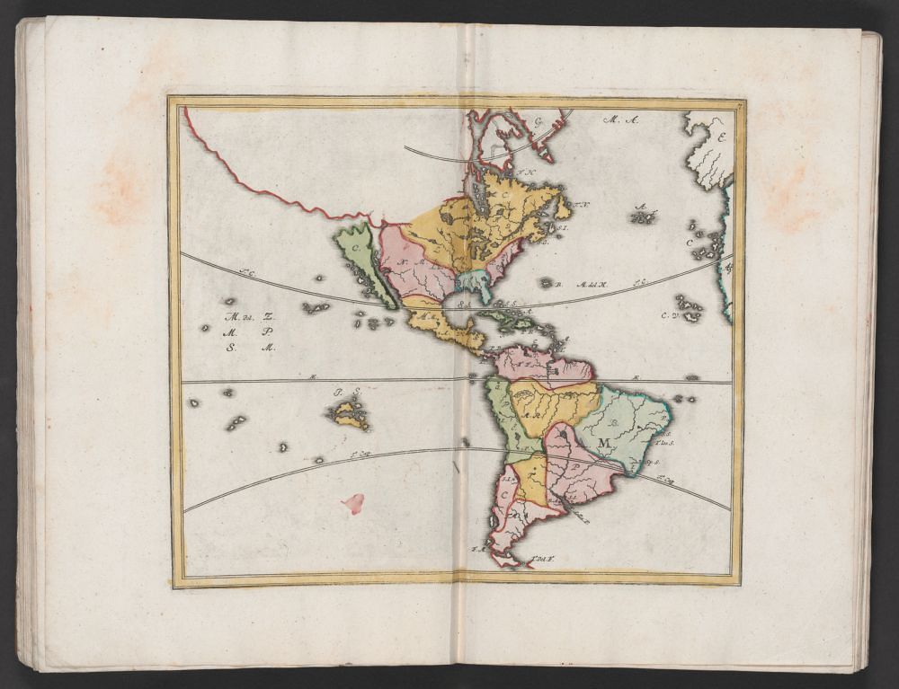 Antique map of South and Central America in an open book.