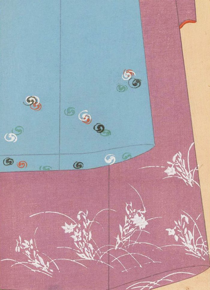 Close-up of a garment with turquoise and reddish-pink fabric adorned with swirls and floral patterns.