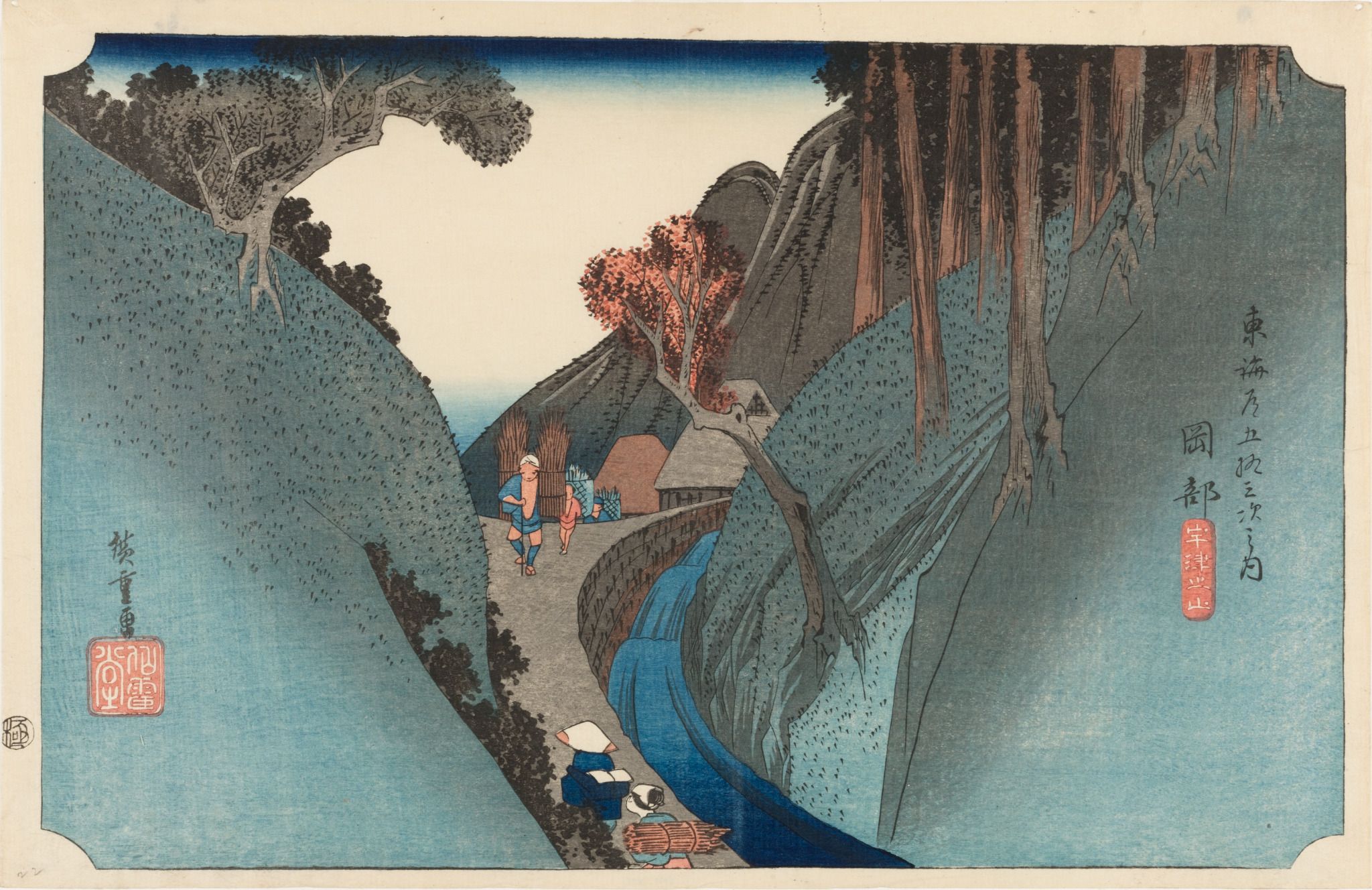 A Japanese woodblock print depicting a mountainous landscape with a winding river and figures traveling along a path.