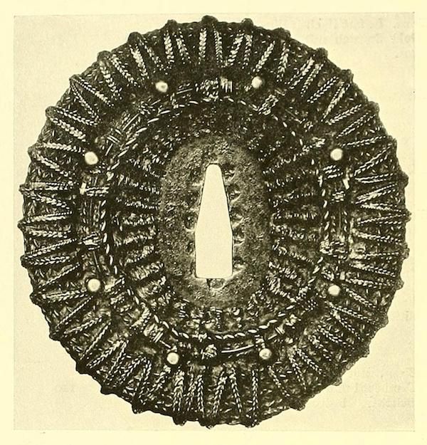 Vintage illustration of a wreath made of grain and berries.