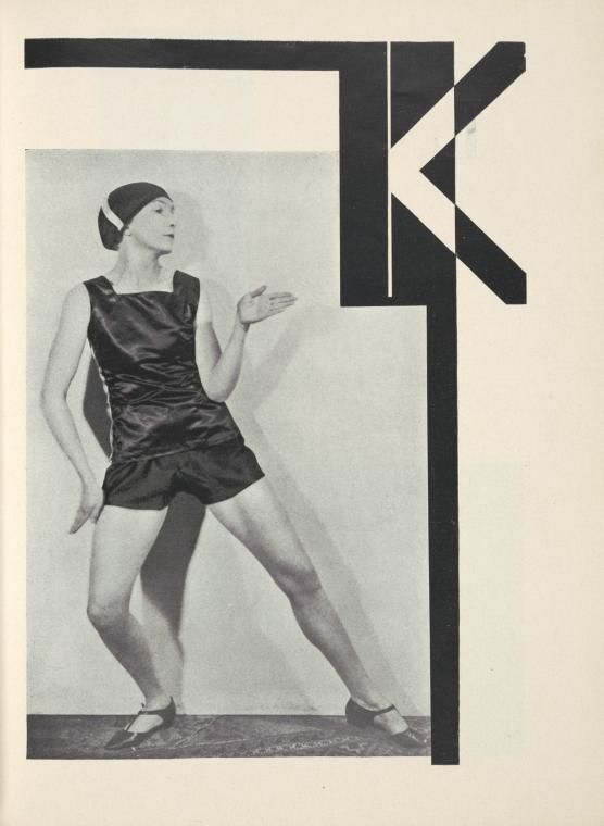 Black and white photograph of a woman in a flapper dress with a large stylized letter 'K' to the right.
