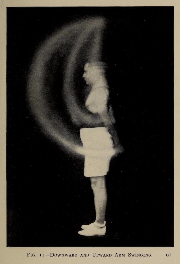 Vintage black and white photograph of a person swinging their arms, captured with motion blur to show movement.