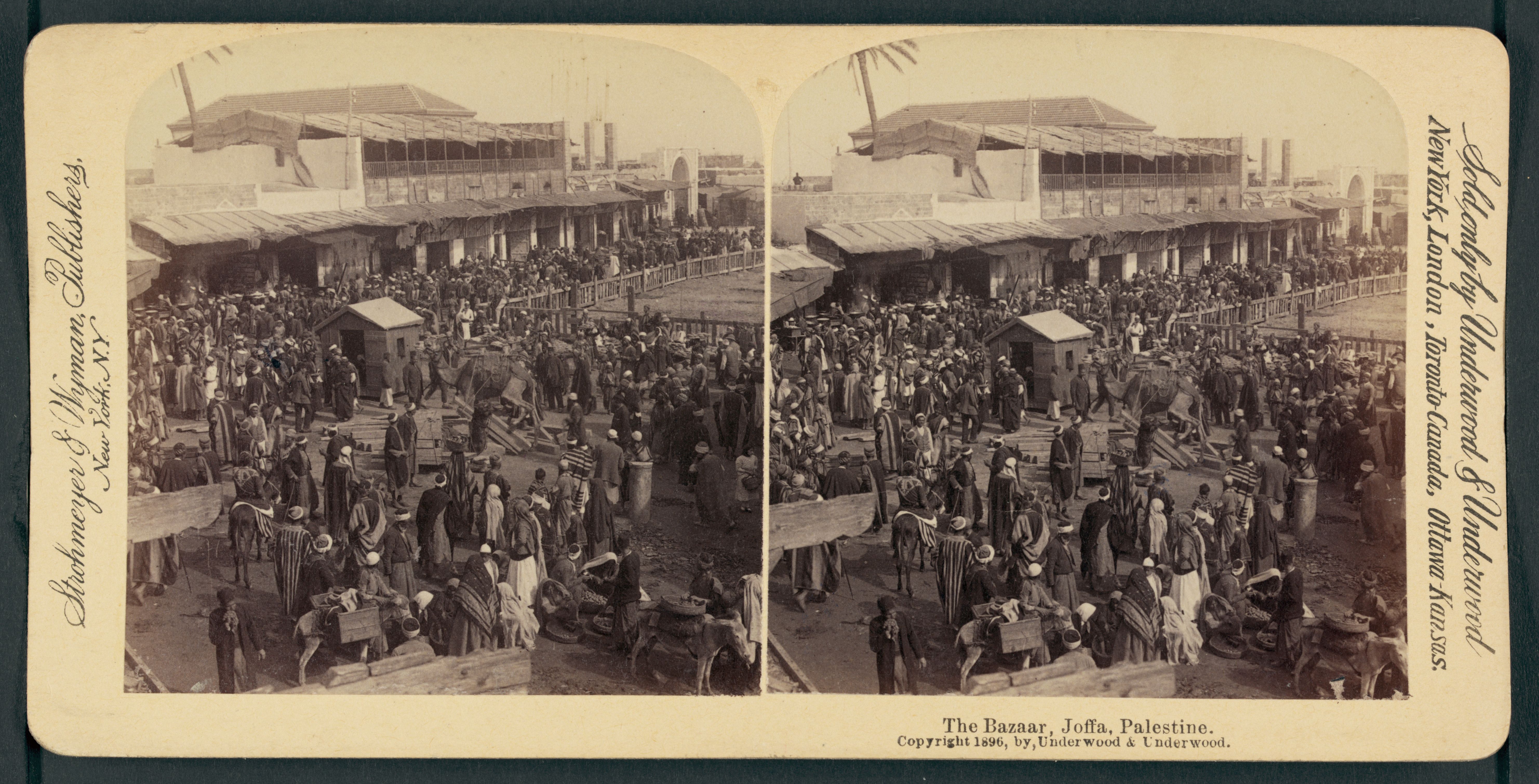 Stereoview photograph of a bustling bazaar in Jaffa, Palestine, filled with people in traditional clothing browsing stalls and tents.