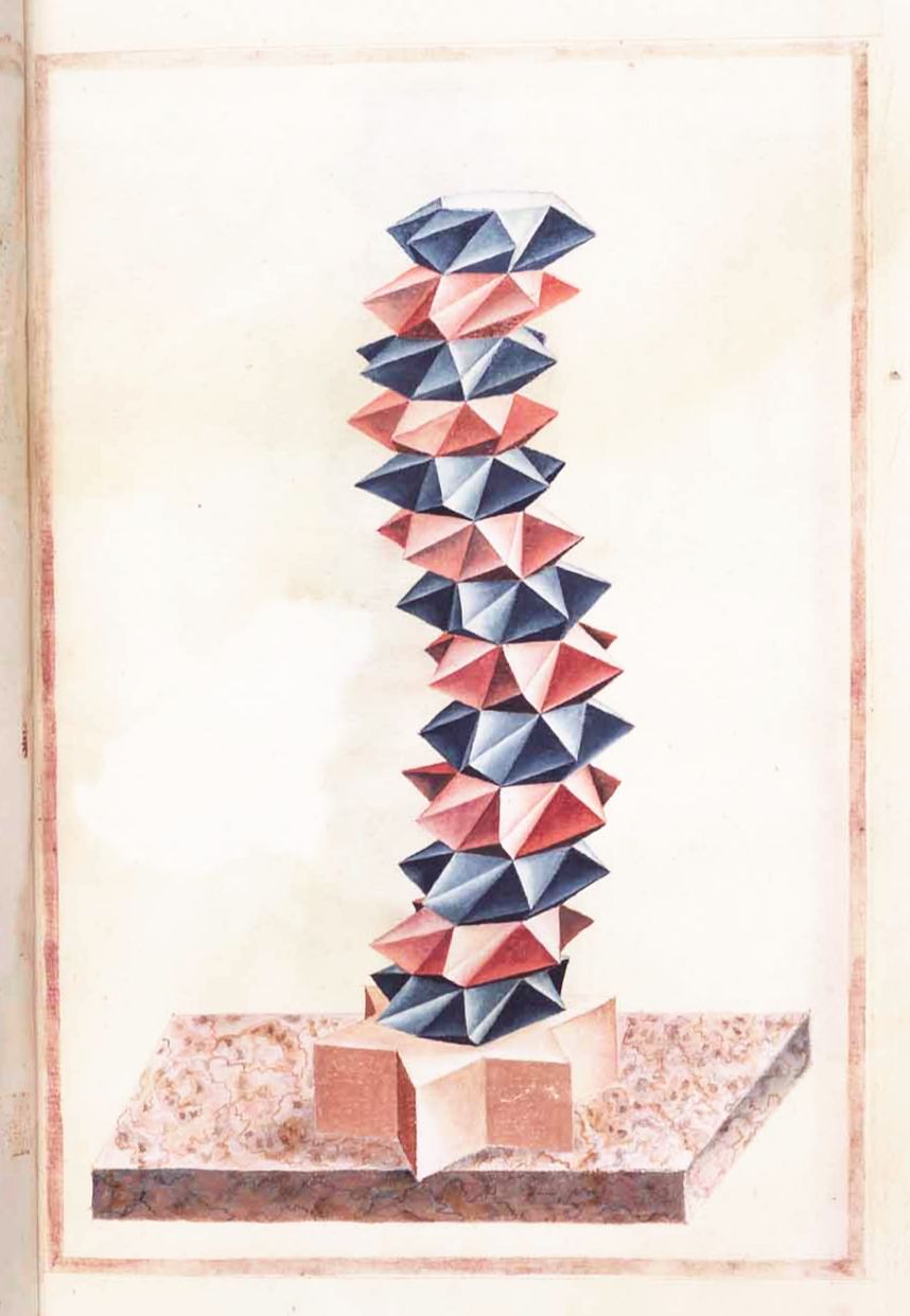 A tall stack of alternating red and dark blue triangular pyramids, balanced on a reddish-brown base on a dark brown table.