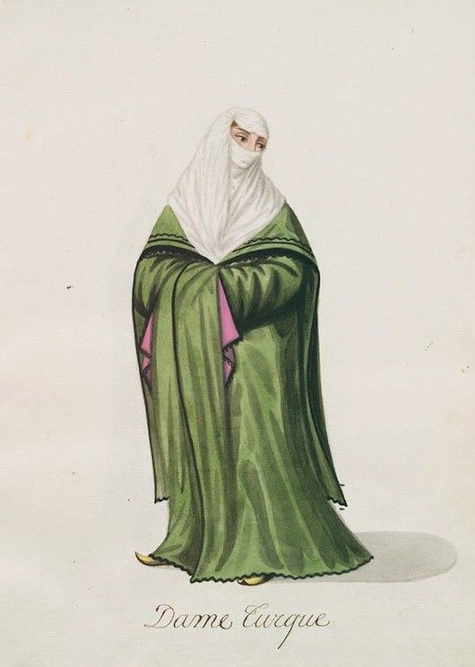 A watercolor painting of a Turkish lady in traditional attire, labeled 'Dame Turque'. She is fully covered in layers of clothing, including a long olive-green dress, a dark robe, and a white veil that covers her head and face, leaving only her eyes visible.