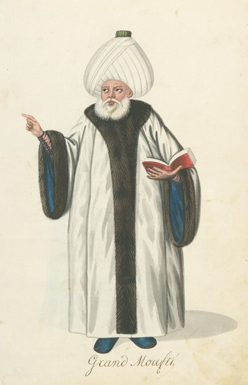 A full-body portrait of a Grand Moufti in traditional Ottoman attire, holding a book and pointing with his right hand.
