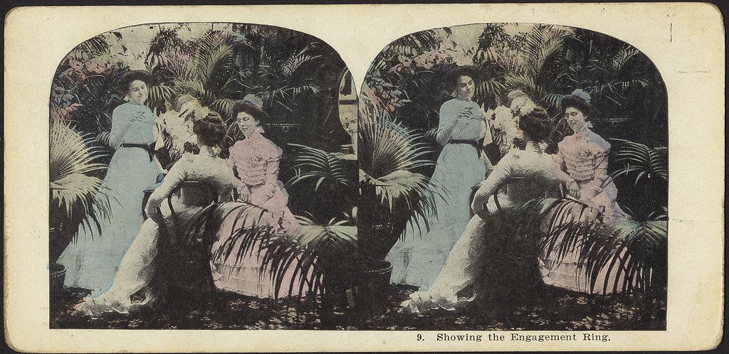 Stereoscopic card showing a man proposing to a woman with an engagement ring in a tropical setting.