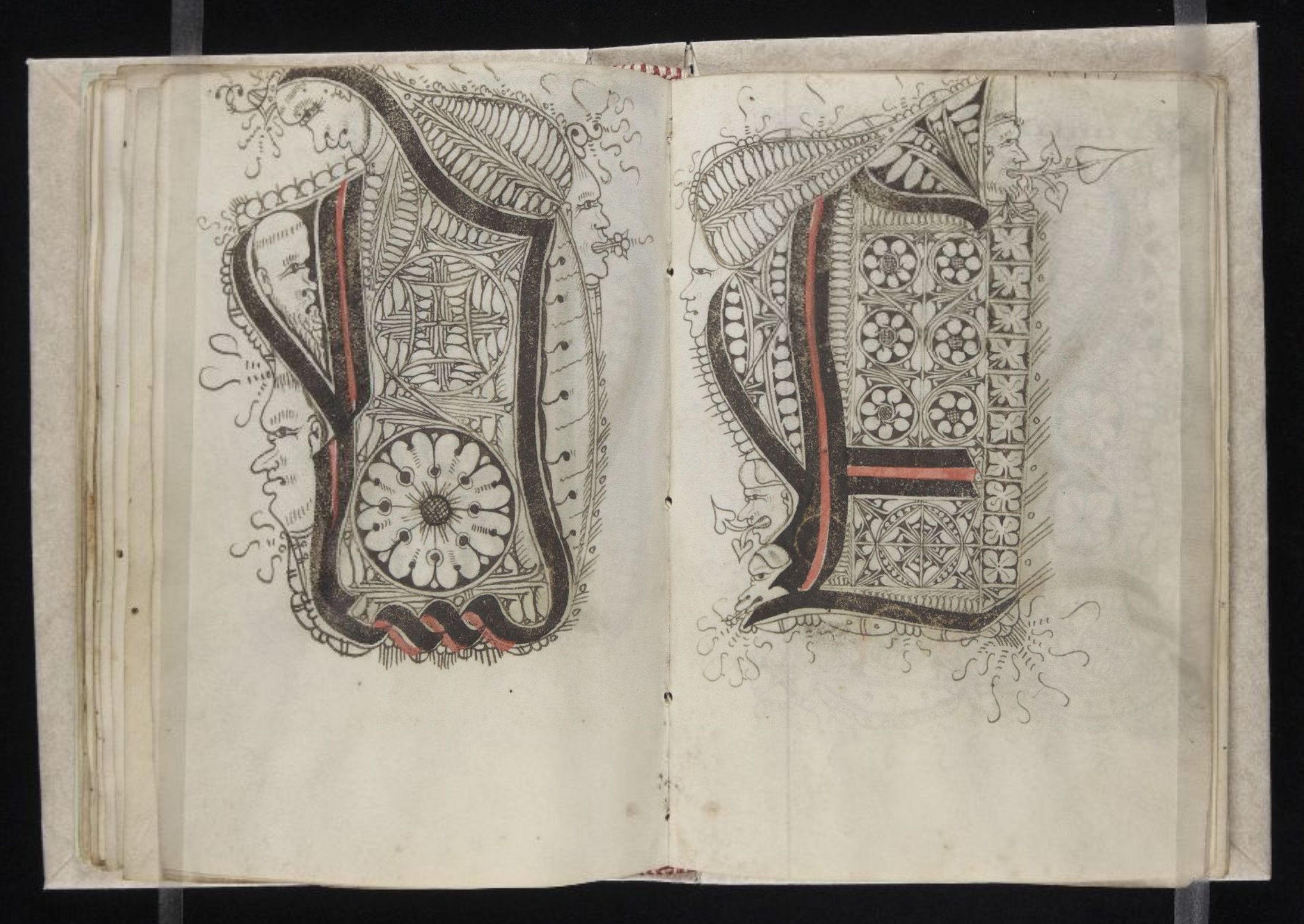 Open page from an old manuscript with an ornate illuminated letter 'U'.