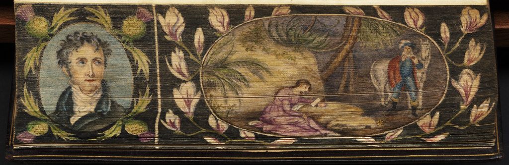 A detailed painting on a rectangular surface, featuring a portrait of a man on the left and a complex scene with reclining figures on the right, all framed by ornate floral decorations.