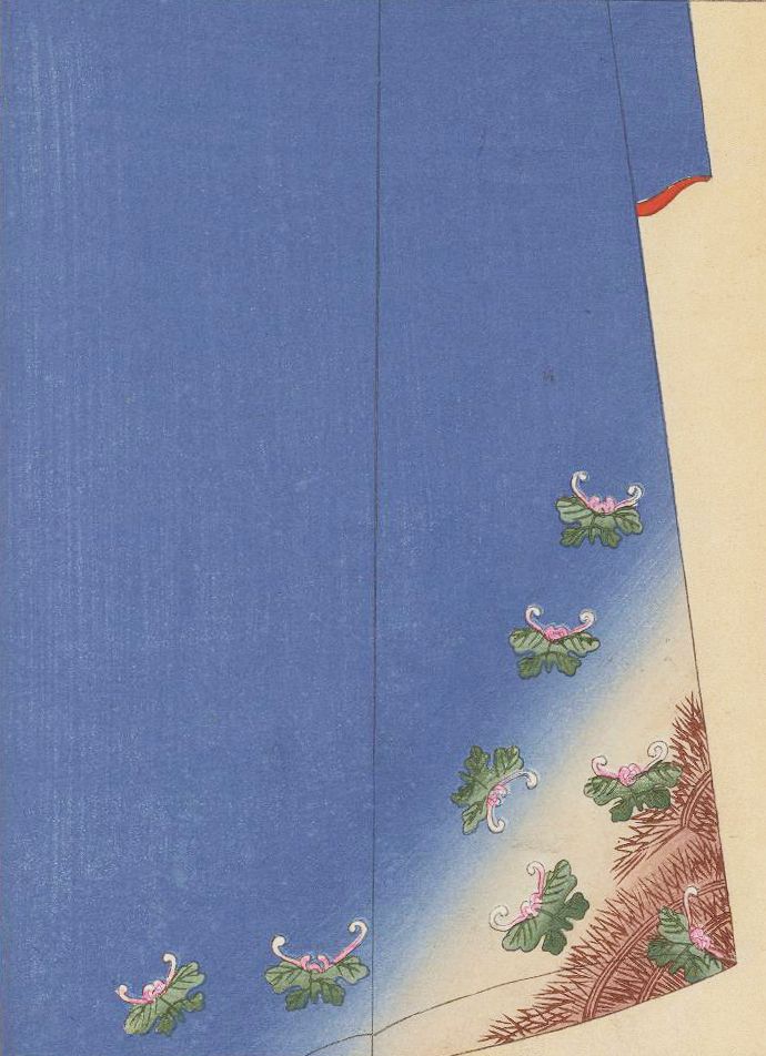 Close-up of a blue garment with delicate floral embroidery.