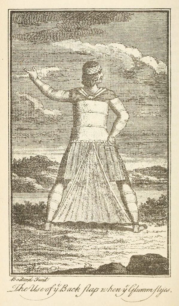 Vintage black and white engraving of a tall man in flowing robes standing in a landscape with a dramatic sky.