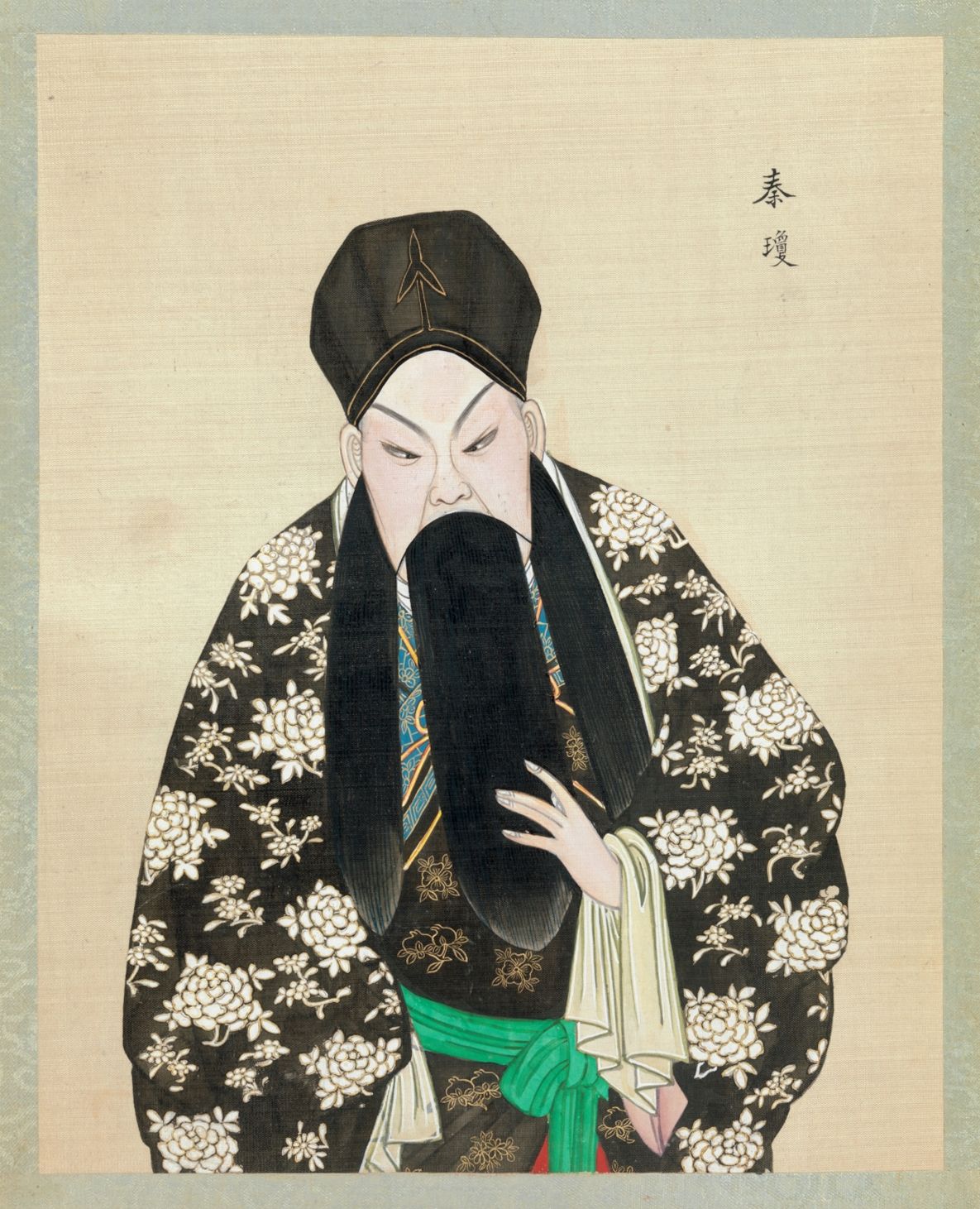 Portrait of a man in traditional Chinese attire with a long white beard and ornate robe.
