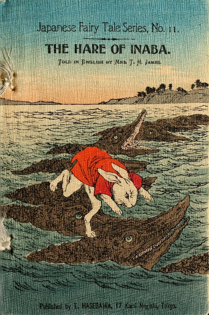 Vintage book cover illustration of a hare riding a crocodile in water, with mountains in the background.